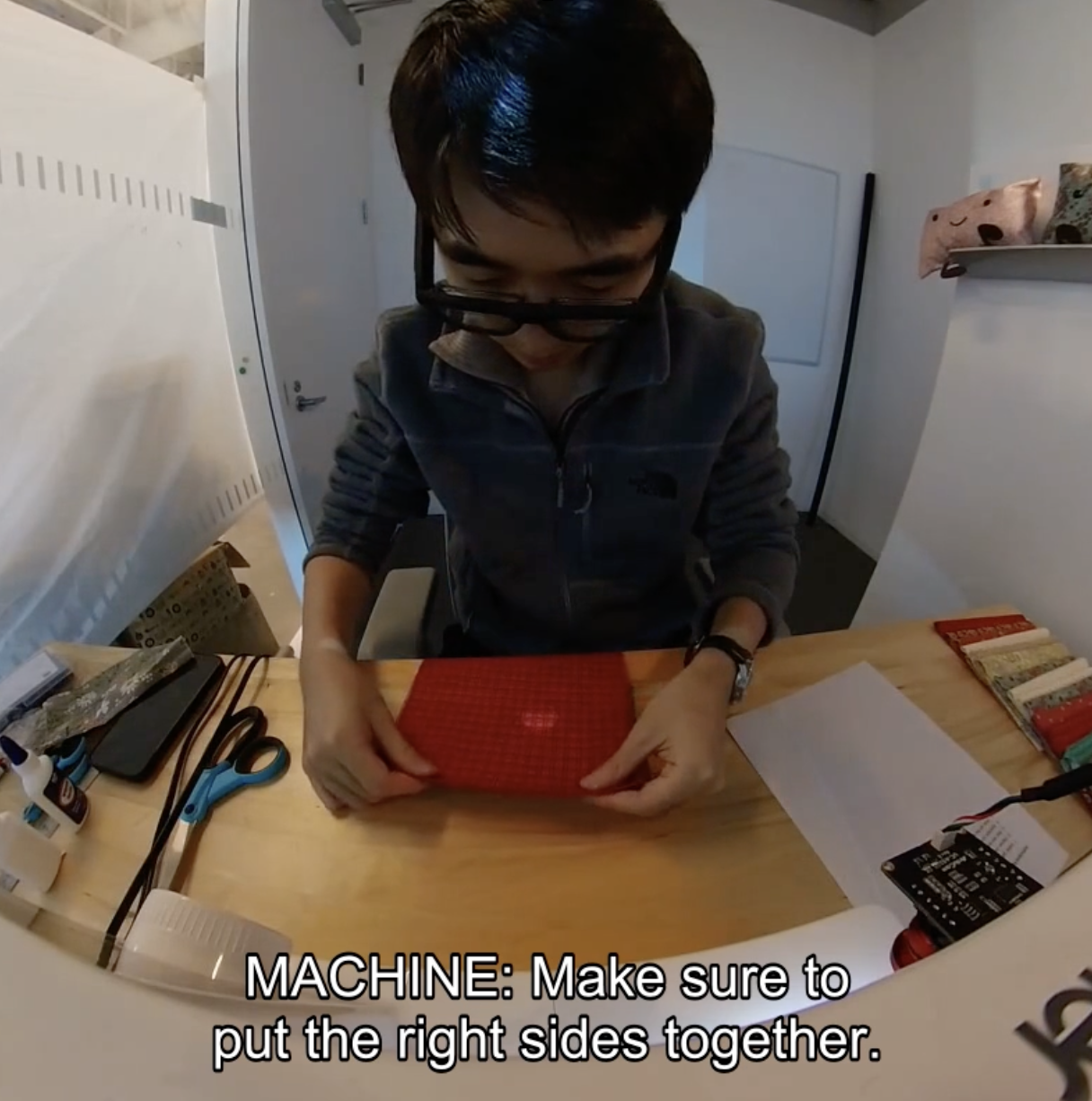 participant interacting with intelligent sewing machine